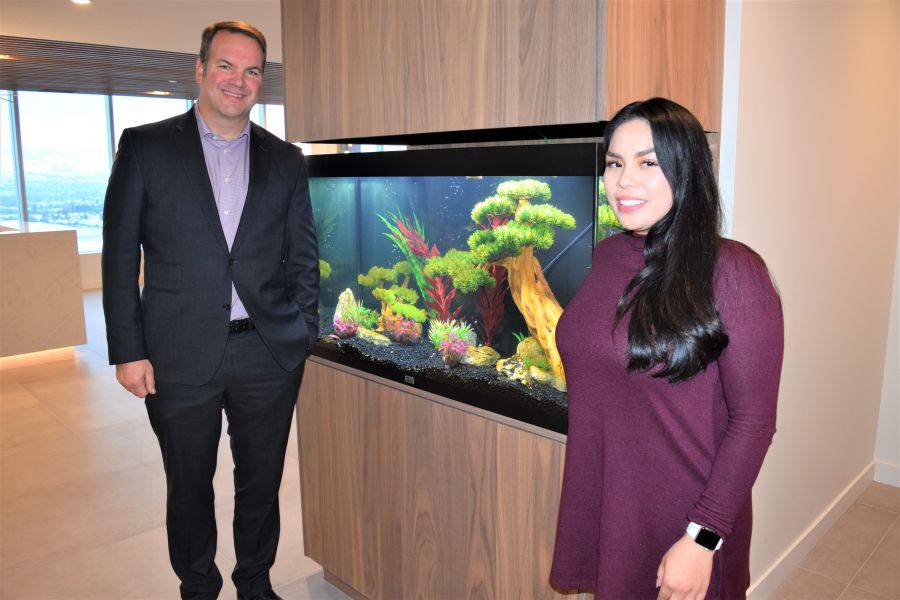 </who>At the fish tank that welcomes people as they get off the elevator are wealth advisor Mark Mariotto and associate vice-president Jennifer Hochstein.