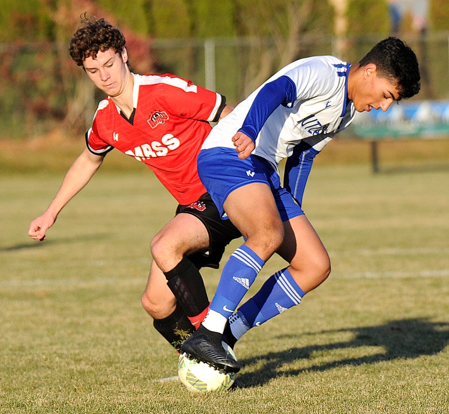 Boucherie's Konstantin Pfeiffel, left, and Rutland's Jayden Boparai on a 50/50 ball.