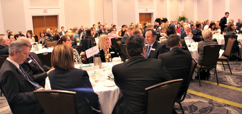 <who> Photo Credit: KelownaNow. </who> It was a packed house at the Coast Capri hotel for the Mayor's speech to the Chamber of Commerce. 