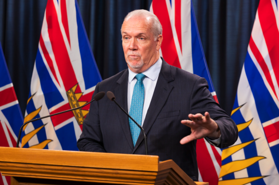 <who> Photo credit: BC Government </who> Horgan during a press conference last week.