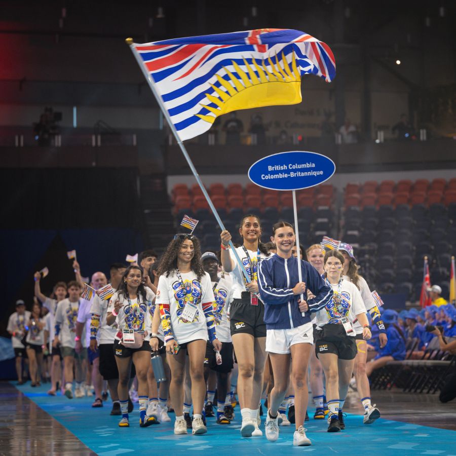 <who> Photo Credit: Team BC Twitter </who> Team BC walks in during opening ceremonies on August 6. 