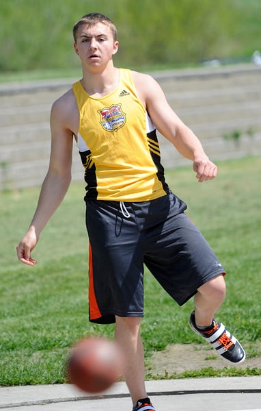 <who>Photo Credit: Lorne White/KelownaNow </who>Nick Cornell of Kelowna Secondary School finished first in three <br>Central zone events including the senior shot put.