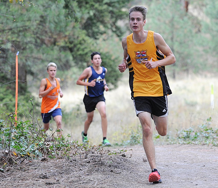 <who>Photo credit: Lorne White/Kelowna Now </who>Dayton Bath, right, of KSS placed third among the senior boys in the first high school cross country rum of the season.