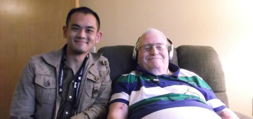 <who> Photo Credit: UBC Okanagan </who> UBC Okanagan student Gary Su with one of the Baptist Housing clients he worked with during the Music and Memories project.
