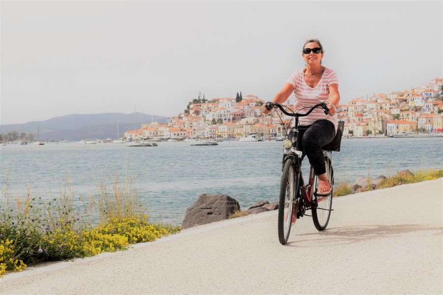 </who>Cycling Poros' seafront.