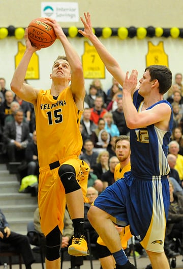 <who>Photo Credit: Lorne White/KelownaNow </who>Grant Shephard drives hard to the rim for two of his 13 points. 