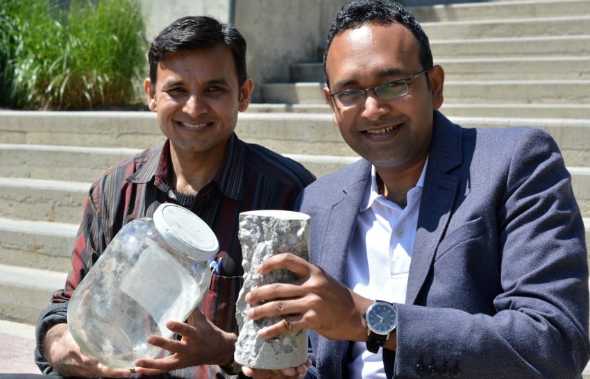 <who> Photo Credit: UBCO </who> UBC's Anant Parghi (left) and Shahria Alam hold up a piece of 'green' concrete and some of the glass that helped make it.