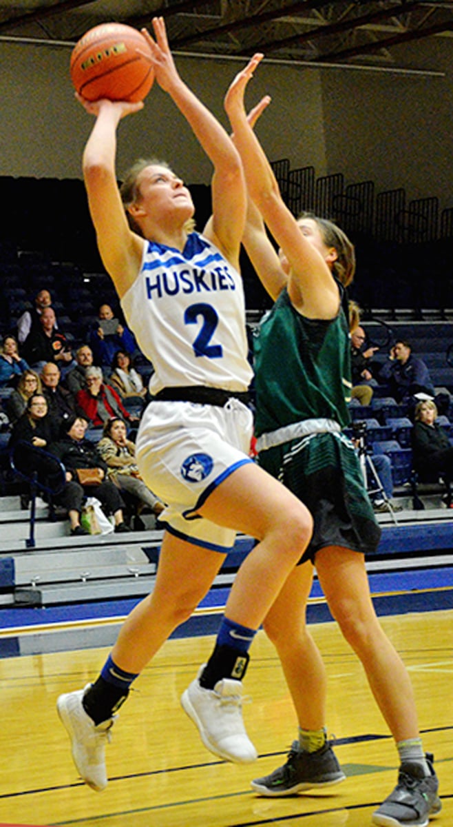 <who>Photo Credit: Contributed </who>Jordan Bury drives to the hoop against Langley Christian on Friday in Langley.