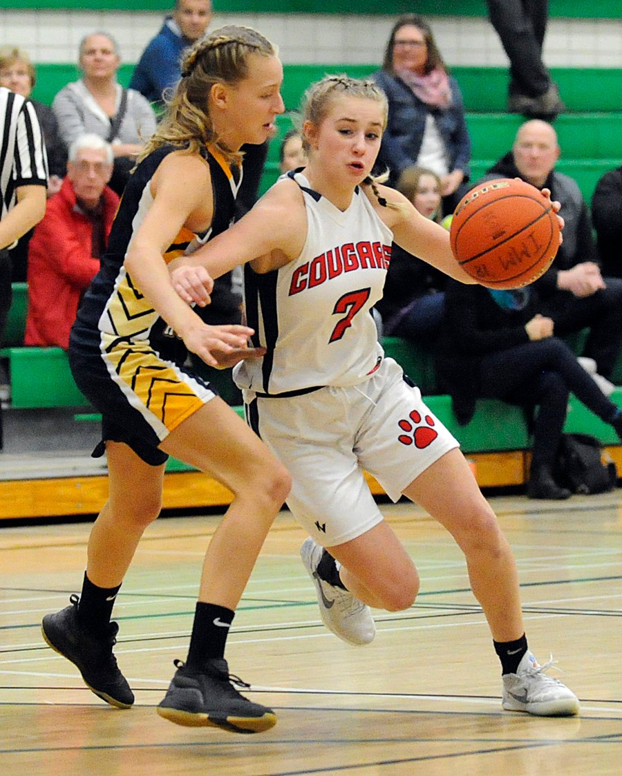 <who>Photo Credit: Lorne White/KelownaNow </who>Phoebe Molgat, right, of the KLO Cougars scored 14 points in the bronze-medal game and was selected as a tournament all-star.