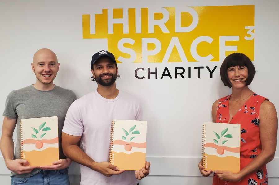 </who>Photo credit: Contributed | Switch Research co-founders Ian Wilson (far left) and Naved Avery stopped by Third Space Charity to deliver donated copies of their Self-Love Journal to executive director Karen Mason.