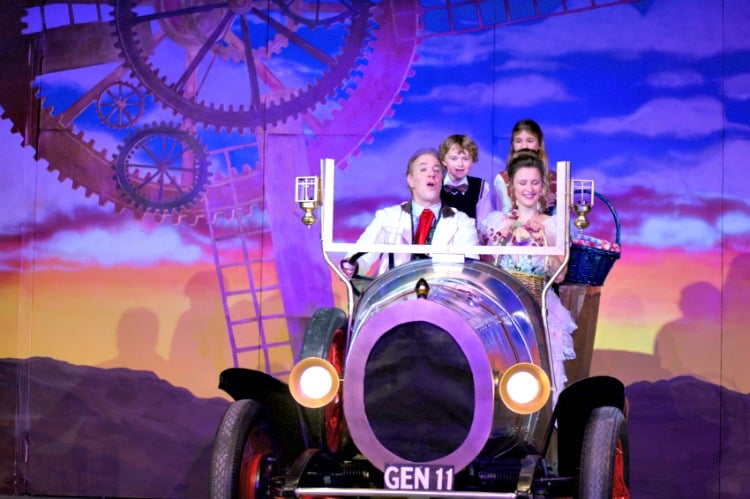 <who> Photo Credit: contributed. </who> The Potts family and Truly Scrumptious driving in Chitty Chitty Bang Bang. 