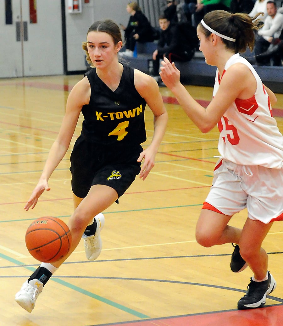The Owls' Katerina Fink scored 18 points in the Owls' regular-season win over Mt. Boucherie this week. On the right is the Bears' Merce Juncosa.
