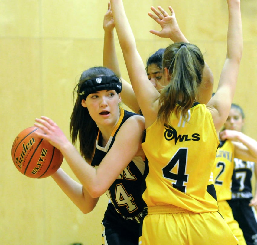 <who>Photo Credit: Lorne White/KelownaNow </who>The Huskies' Makenna Jacklin found enough room to score 12 points against the KSS Owls.