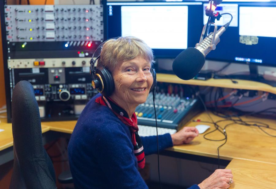 <who> Photo Credit: NowMedia</who>Programming trainee Carole Punt in the station's studio.