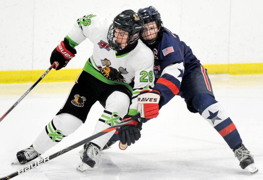 Ryan Antonakis of the Kelowna Chiefs makes a power move to the net against the Spokane Braves' defence in their 11-2 victory at the Rutland Arena.