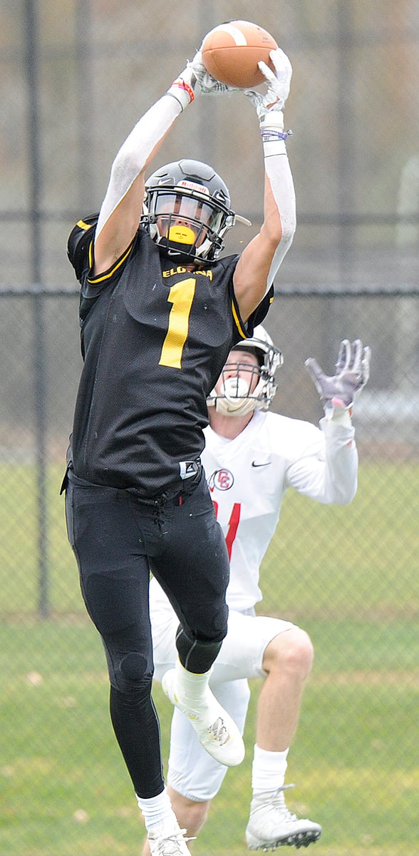 Isaac Athans leaps to intercept an Eagles pass on an attempted two-point conversion.