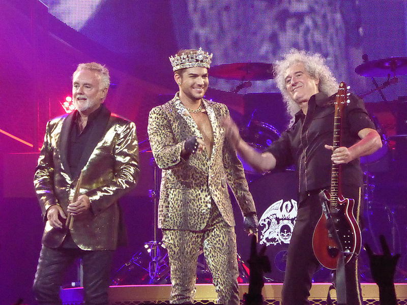 <who>Photo Credit: Wikipedia</who>Roger Taylor, Adam Lambert and Brian May.