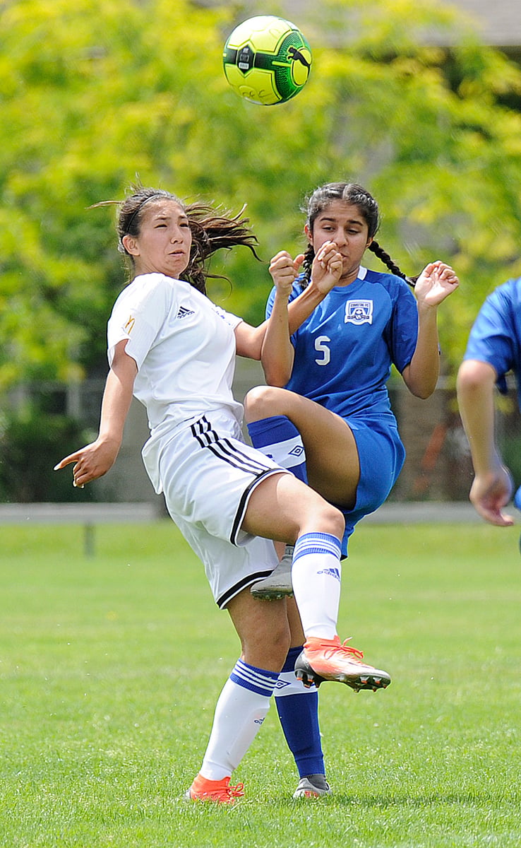 <who>Photo Credit: Lorne White/KelownaNow </who>West Kelowna's Abigail Taneda battles for an airball at Beasley Park in Lake Country.