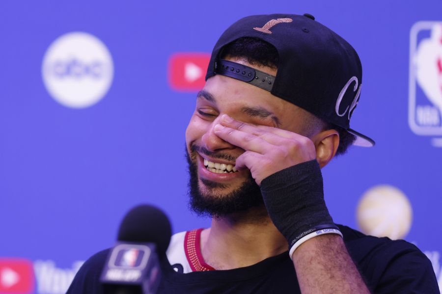 <who>Photo Credit: Getty Images</who>Jamal Murray wipes away tears after becoming the 9th Canadian ever to win the NBA title.