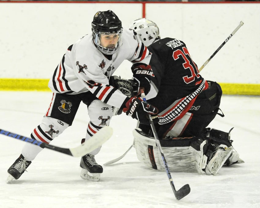 <who>Photo Credit: Lorne White/NowMedia </who>Juanre Naude of the Chiefs chases a loose puck behind Summerland goaltender Matthew Huber just prior to assisting on the second Kelowna goal.