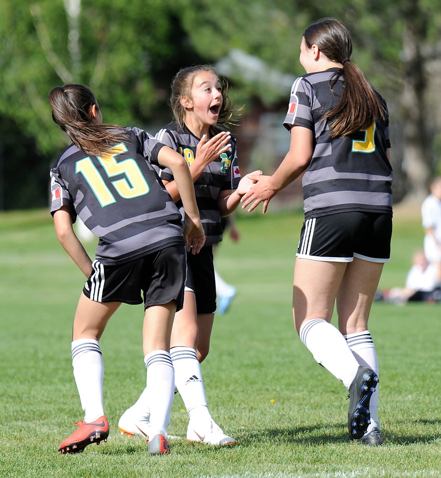 From left, Sophia De Pieri, Taylor Melnyk and Damia Thalheimer celebrate an Immaculata goal.