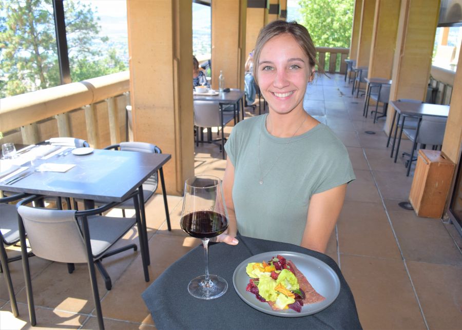 </who>Server Alexandra Jacques shows off the Mission Hill 2019 Legacy Collection Prospectus (Pinot Noir) that's paired with the Wagyu eye-of-round carpaccio at Mission Hill Family Estate's Terrace Restaurant.