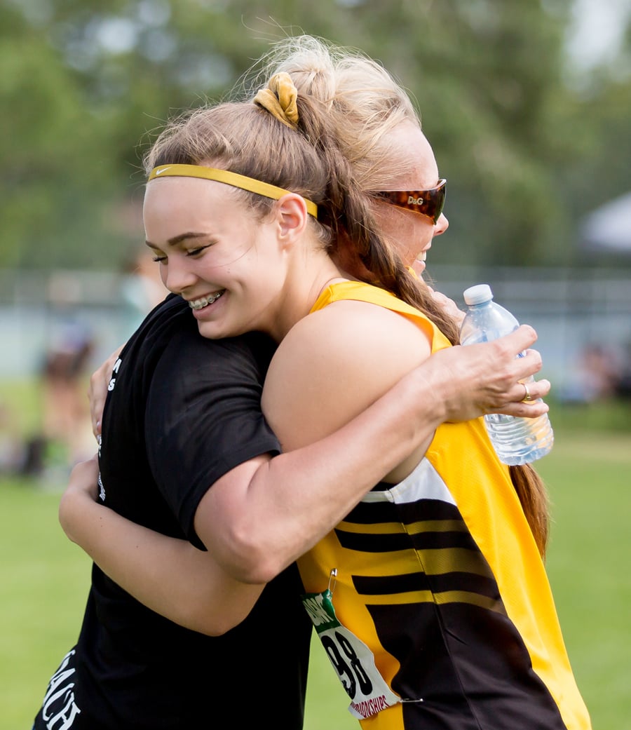 <who>Photo Credit: Candid Apple Photography </who>Emma Cannan and Okanagan Athletics Club coach Pat Sima-Ledding celebrate another win.