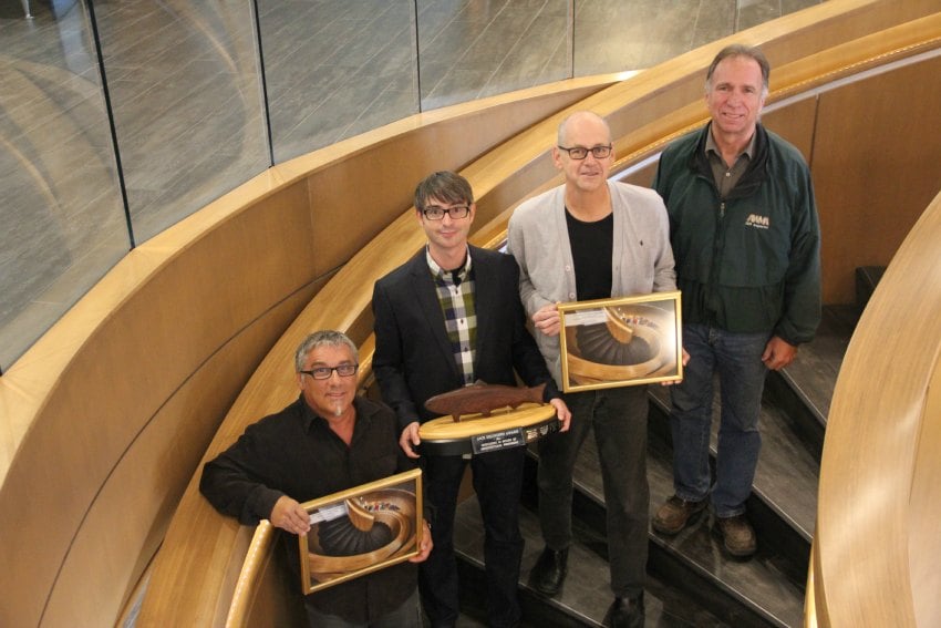 <who> Photo Credit: KelownaNow.com </who> left to right: Jack Mendes, President Top 40 Woodworks, Stoke Tonne, Meiklejohn Project Architect, Jim Meiklejohn, Principle Meiklejohn Architects, Mike Budd, Inspector at Architectural Woodwork Manufacturers Association. 