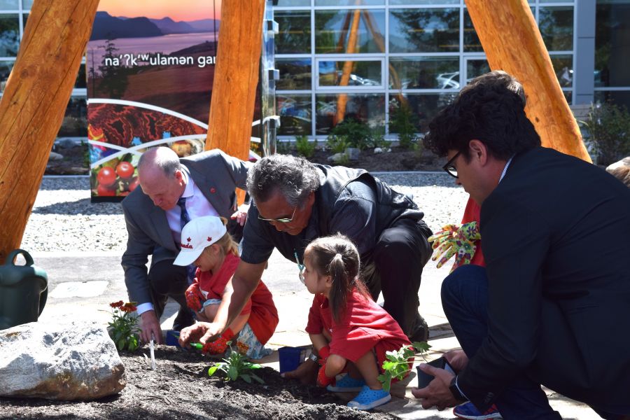 <who>Photo Credit: Contributed</who>Children from Little Scholars daycare joined by Jim Hamilton, Grouse Barnes and Chris Derickson in planting the final six plants in the garden