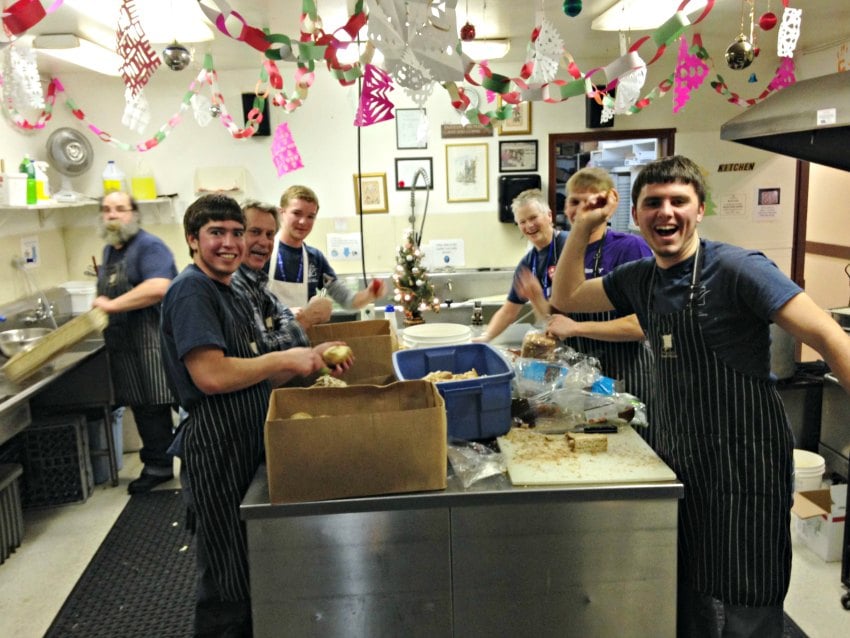 <who>Photo Credit: Kelowna Gospel Mission</who>Volunteers work hard to prepare Christmas dinner in 2014.