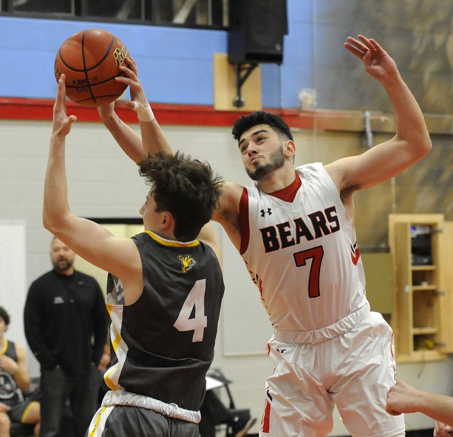 Eren Korkmazel of the Bears cuts short an offensive burst by Malcolm Greggor.