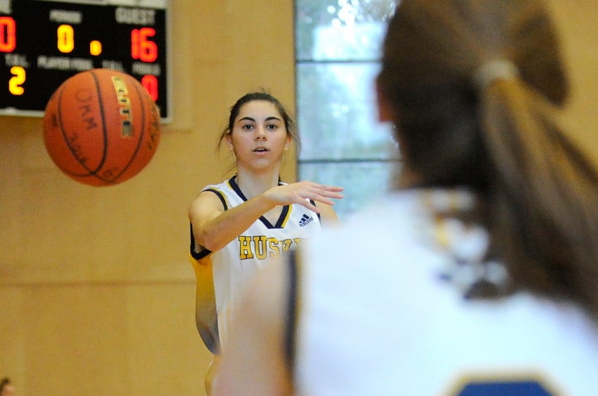 <who>Photo Credit: Lorne White/KelownaNow </who>Reanne Mitchell scored 13 points in OKM's commanding win over the host York House Tigers in Vancouver.