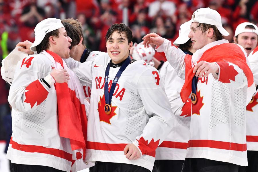Zellweger (centre) celebrates World Junior gold just last week.