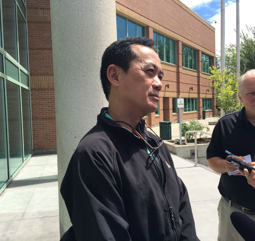 <who> Photo Credit: KelownaNow. </who> Darwin Rosales speaking to the press outside of Kelowna Law Courts June 22.