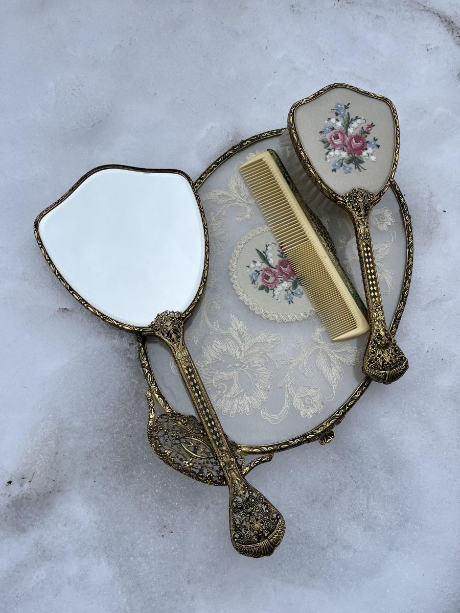 <who> Photo Contributed </who> The antique vanity set that is currently available to trade.