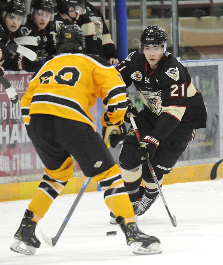 Colby Elmer goes one-on-one against Coquitlam's Steven Bellini.