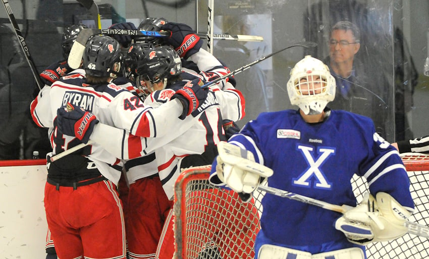 <who>Photo Credit: Lorne White/KelownaNow </who>The Yale U18 Lions celebrate their first goal behind Northern Alberta Xtreme net minder Ty Grant.