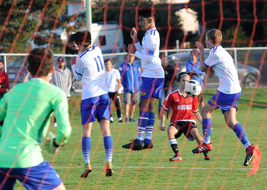 <who>Photo Credit: Lorne White/KelownaNow </who>Justin Matte of the Bears watches his free kick go through a Voodoos wall and head toward the Rutland goal.