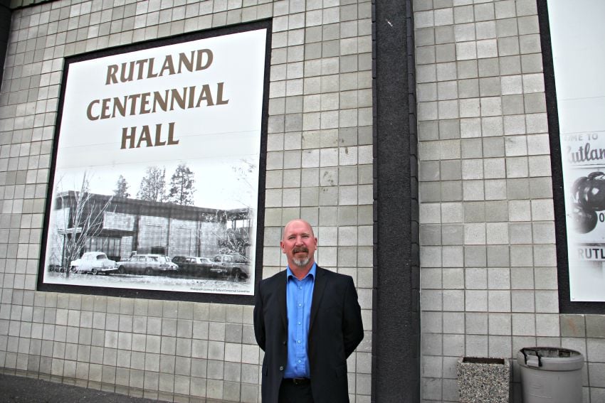 <who> Photo Credit: KelownaNow. </who> Todd Sanderson in front of the Hall.