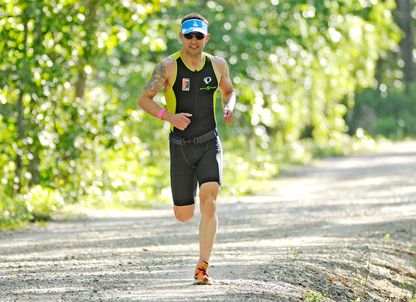 <who> Photo Credit: Lorne White/KelownaNow </who>Nathan Champness of Vernon runs along the Greenway about a kilometre from the finish at line of the Kelowna Cherry Blossom Triathlon.