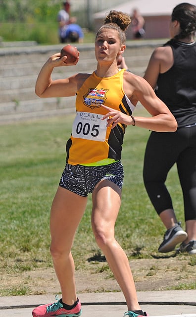 <who>Photo Credit: Lorne White/KelownaNow </who>KSS Owls' Taya Hanson won both the junior girls shot put and <br>400-metre events.