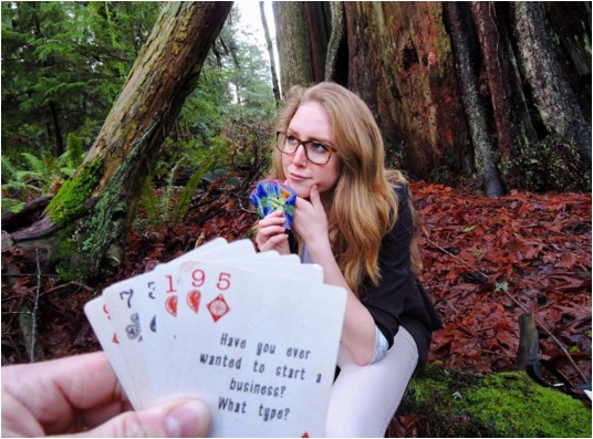 <who> Photo Credit: Basecamp Card Co. </who> Founder Maya Gay, 16, showing off Basecamp Cards. 