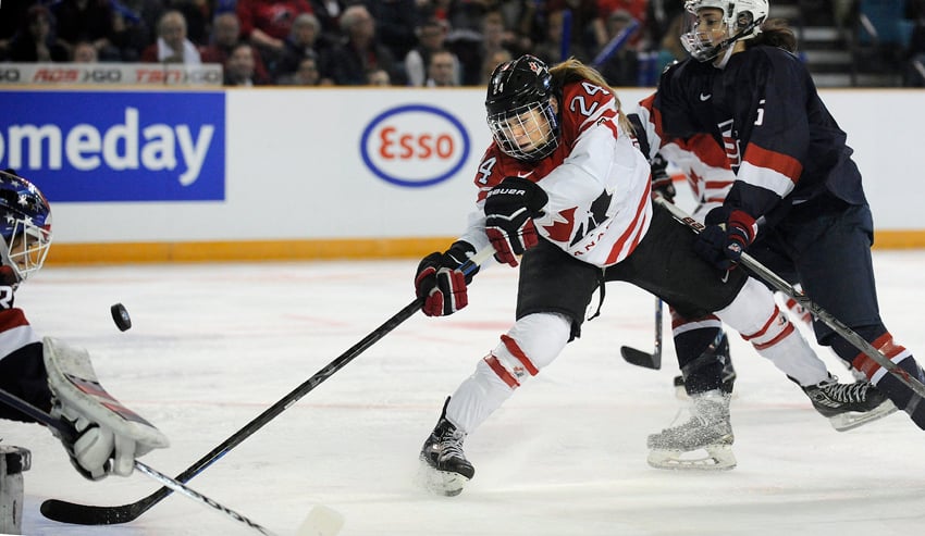 <who>Photo Credit: Lorne White/KelownaNow.com </who>Canada's Natalie Spooner puts United States goaltender Alex Rigsby to the test early in the first period of a 3-1 U.S. victory.