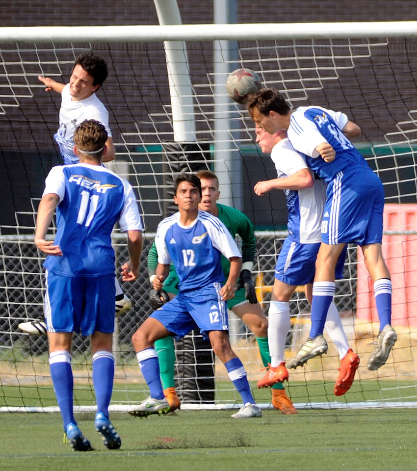 <who>Photo Credit: Lorne White/KelownaNow </who>Kelowna's Sam McDonald of UBCO heads the ball in front of the UVic net in the first half of the Heat's 1-0 win.