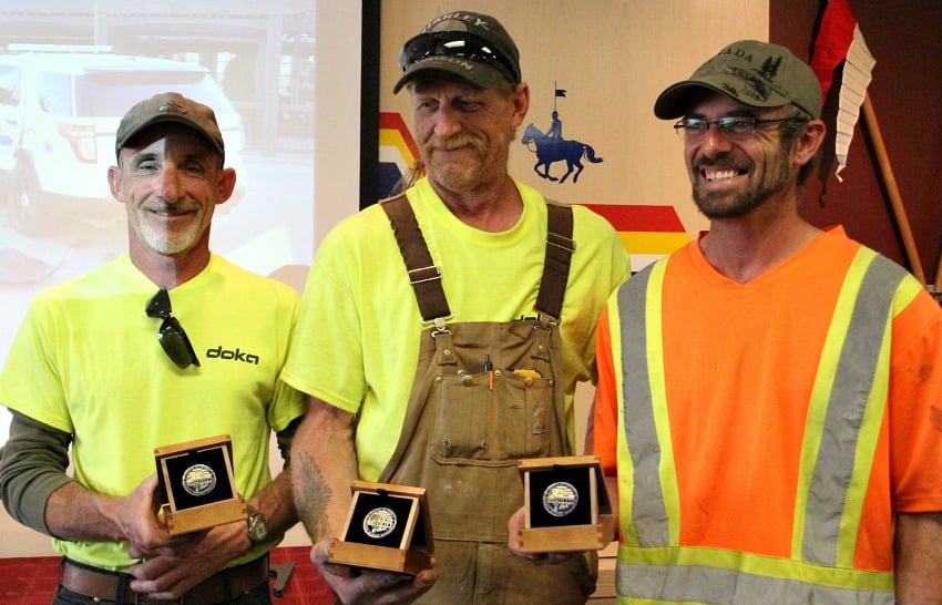 <who> Photo Credit: KelownaNow. </who> (From L to R) Sharpe, Polack and Whitesell show off their coins. 