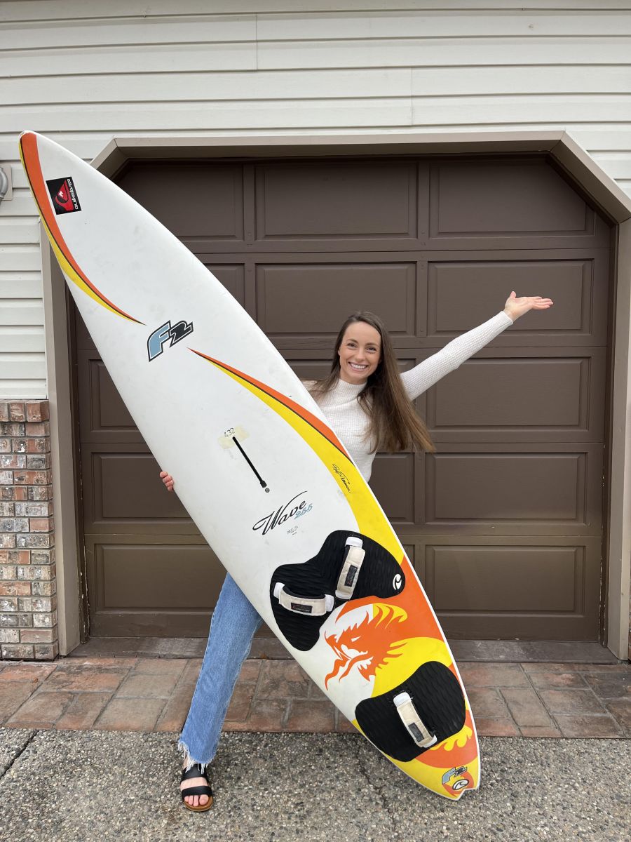 <who> Photo Contributed </who> Stephanie Horman with the traded surfboard. 