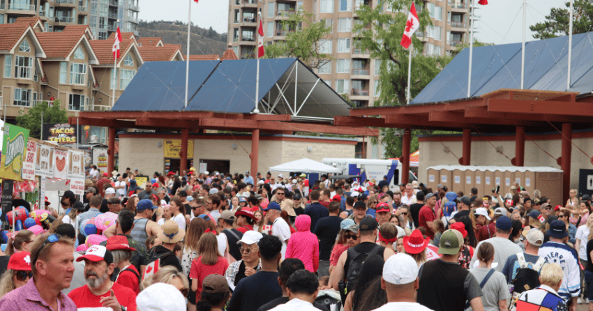PHOTOS: Massive crowds brave the rain to celebrate Canada Day downtown