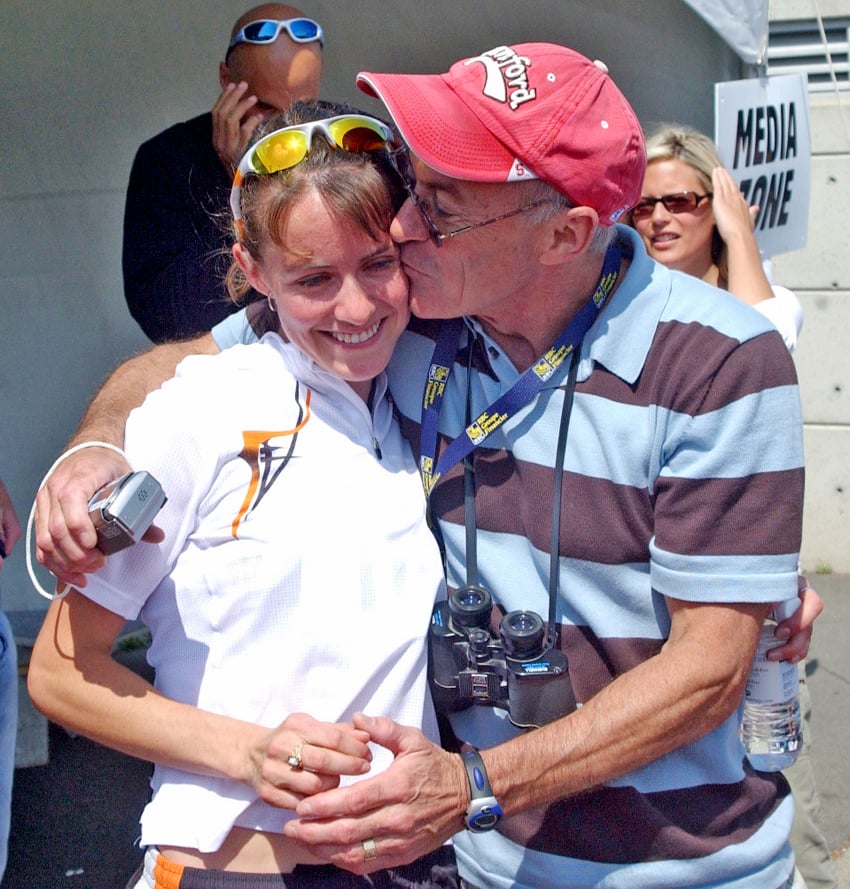 <who>Photo Credit: Lorne White/KelownaNow </who>Malindi Elmore is congratulated by her dad, Doug, after her Canadian championship win in 2004. She recalls with fondness: "That was one of my most special races. It was so amazing to make the Canadian Olympic team, on Canada Day weekend with my family, friends and coach present. On a personal note, Graham (Hood, now her husband) was there too — we went on our first date that weekend! Maybe that’s why I ran so fast!." 