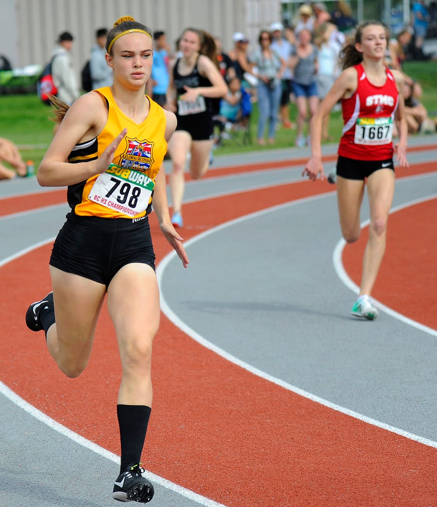 <who>Photo Credit: Lorne White/KelownaNow </who>Cannan runs through the final turn of the junior girls 400-metre preliminary heat. She went on to the final and claimed a gold medal.