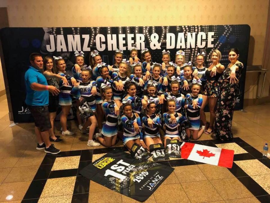 <who>Photo Credit: Contributed</who>Intensity showing off their new champions rings following their first place finish at the Nfinity Champions League. 
